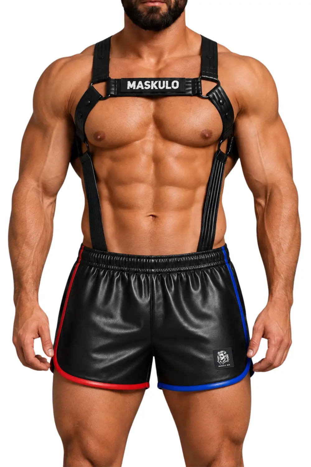A muscular man wearing black strappy harness of artificial leather with 'MASKULO' logo patch on the chest strap, paired with black shorts featuring red and blue side trim, against a plain white background.