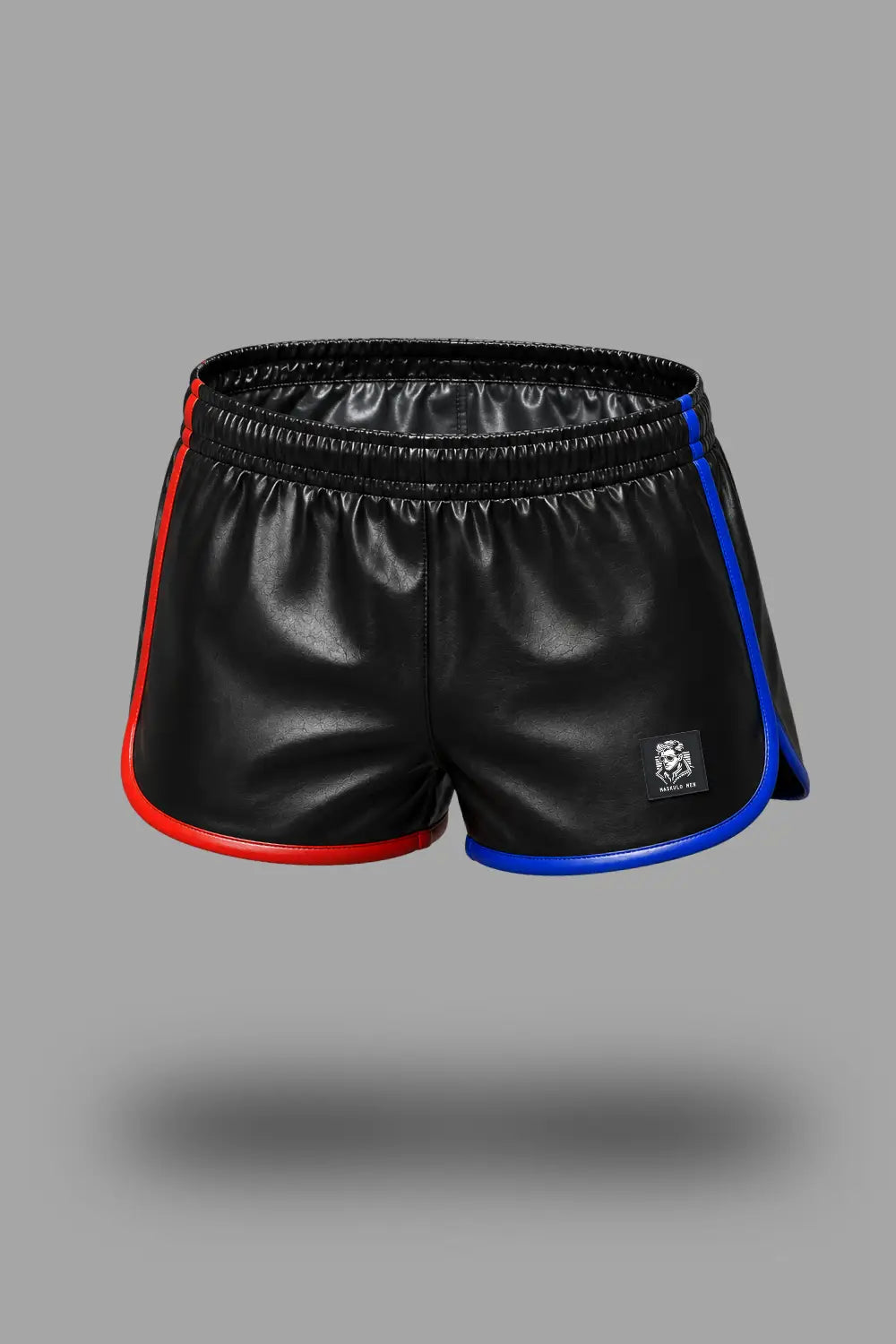 Black athletic shorts with red and blue side piping, featuring a small white logo on the lower left leg, shown against a solid gray background. Axel GoDuo Shorts. Red + Blue. Jogging styled PU Leather Shorts MSH275 - 9 - Official online store Maskulo US, Miami FL